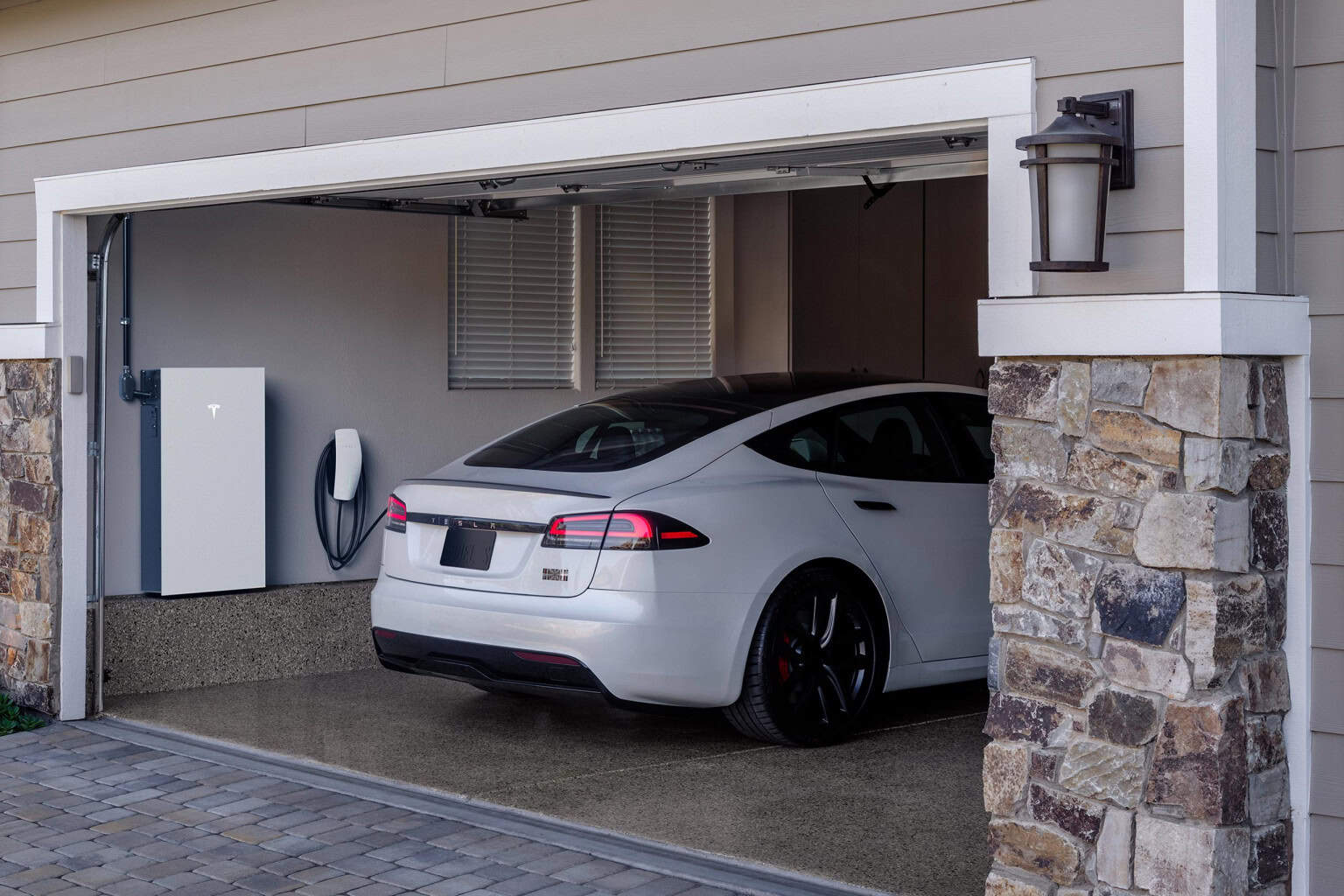 EV charger installation in Spartanburg SC garage Residential garage in Spartanburg SC with professionally installed EV charger unit mounted on wall.