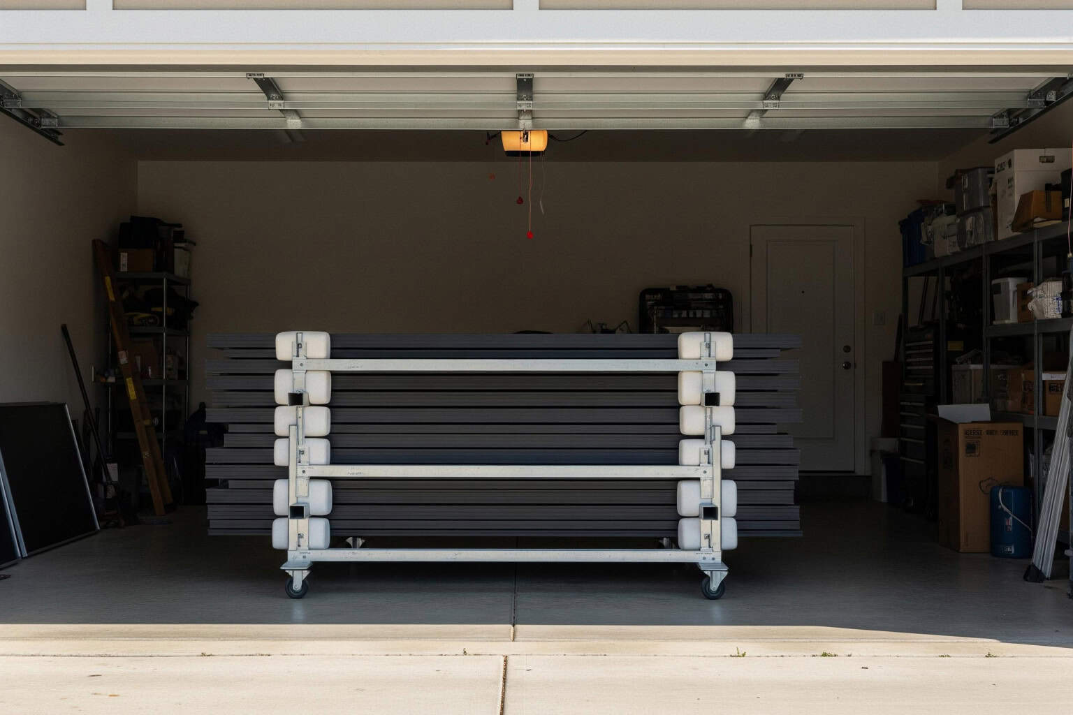 Solar panels safely stored in Upstate SC Solar panels safely stored on padded racks inside a garage during roof replacement in Upstate SC.