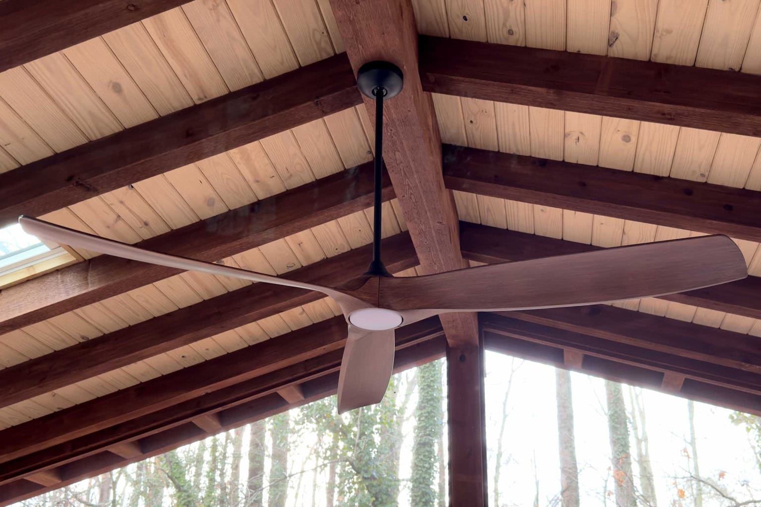 Custom Screened Porch Beam Ceiling — Firefly Construction Greer Beam ceiling with modern ceiling fan inside a custom screened porch built by Firefly Construction in Greer, SC
